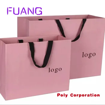 Обичай хартиена торбичка за подарък лого на луксозна марка, произведени по поръчка за дрехи pink штейновая дрехи, чанта за опаковане на бутици за дрехи с лента ръчна изработка